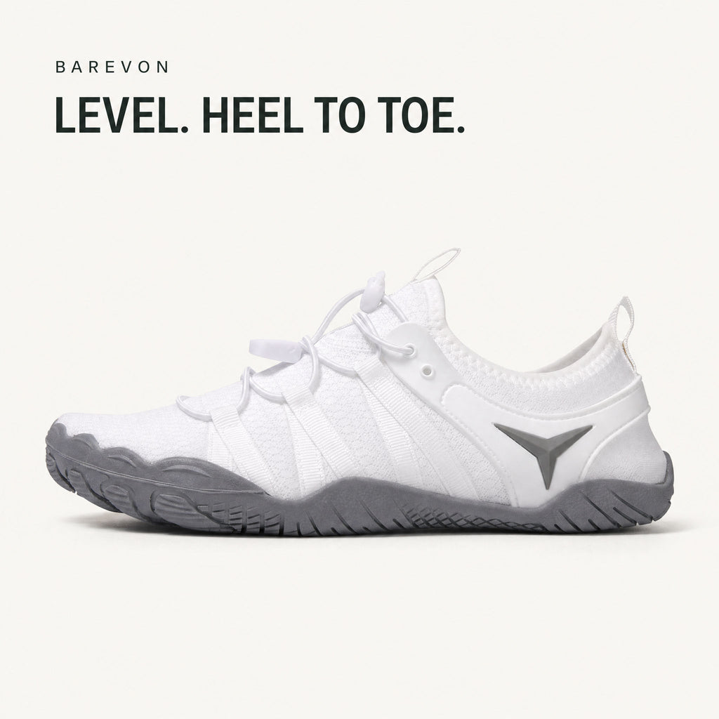 Barevon White cord-lace shoe — level heel-to-toe side profile. LEVEL. HEEL TO TOE.