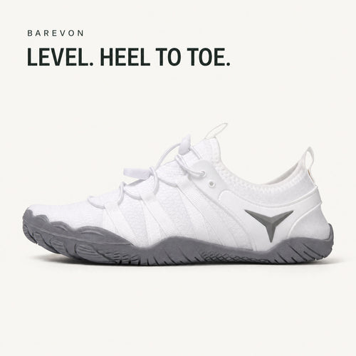 Barevon White cord-lace shoe — level heel-to-toe side profile. LEVEL. HEEL TO TOE.