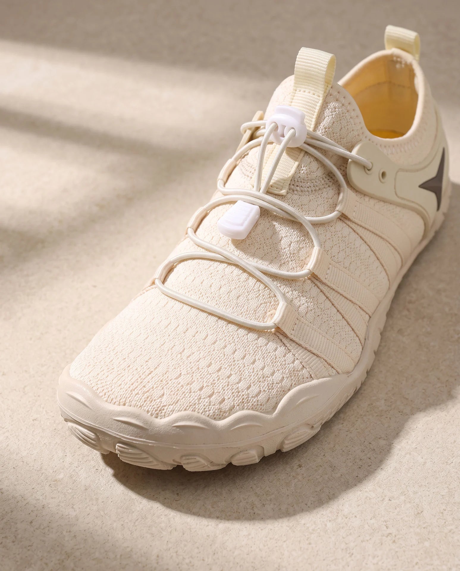 Close-up of the broad rounded toe shape and textured knit upper