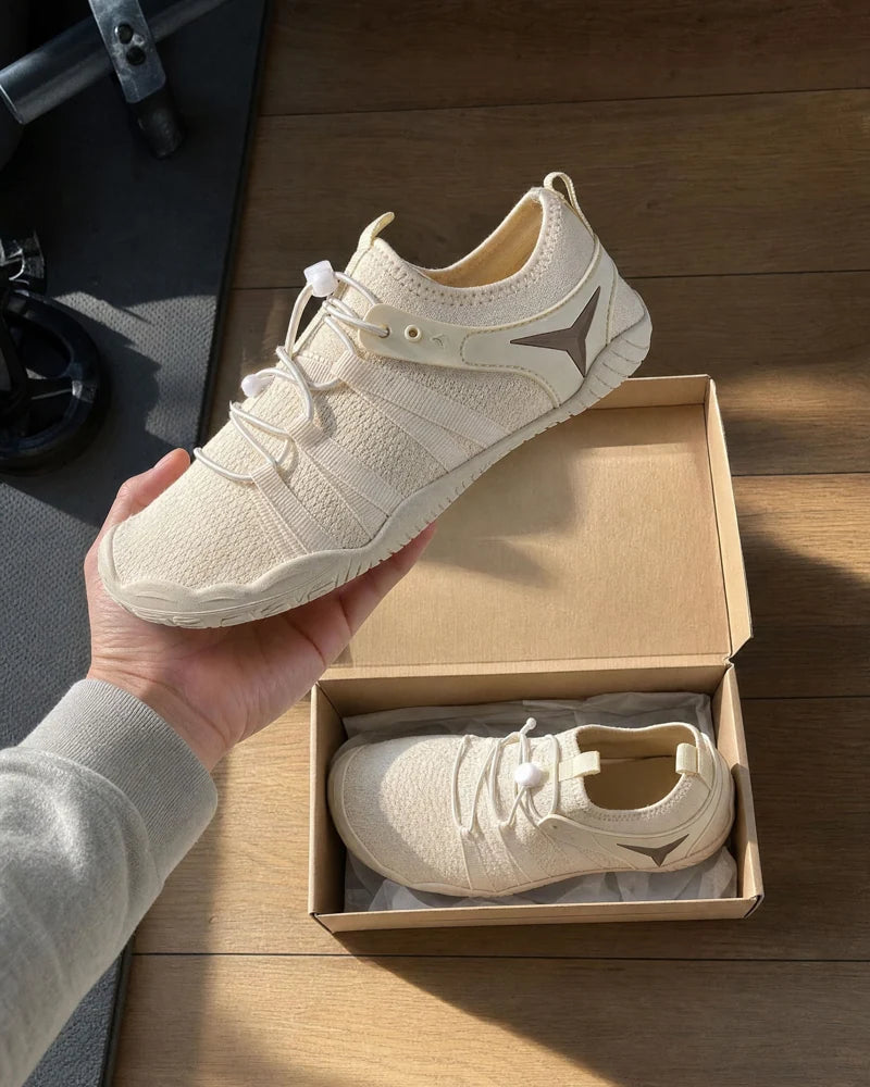 Unboxing a pair of beige Barevon shoes.