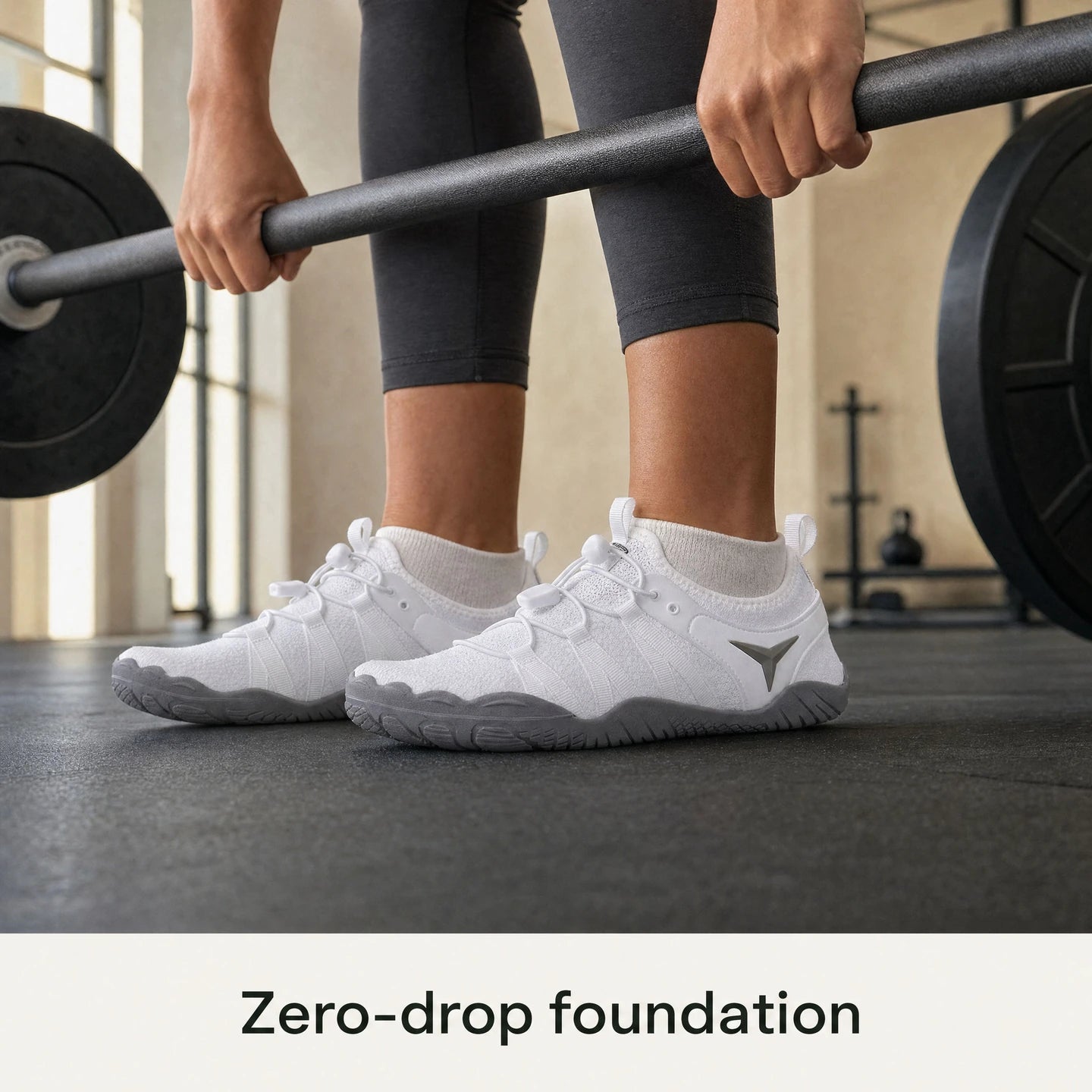 Athlete preparing a deadlift in white Barevon Original shoes.